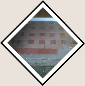 Close up of victorian floor tiles needing renovation